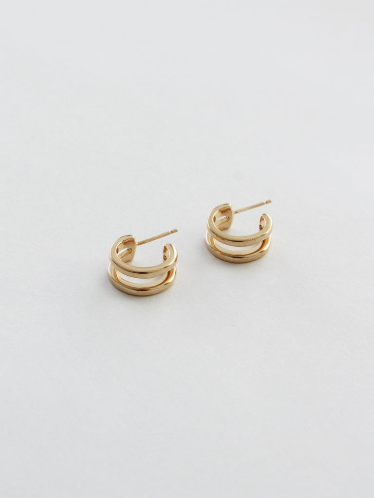 Saturn earrings in gold